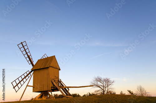 Sunlit old traditional windmill