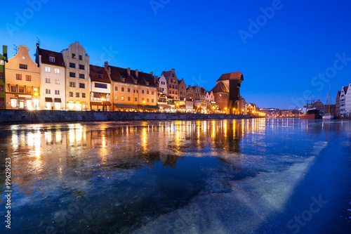 The old town of Gdansk at frozen Motlawa river, Poland