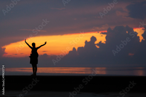 Silhouette of Happiness woman stay outdoor under sunlight of sun