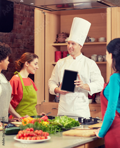 happy women with chef and tablet pc in kitchen