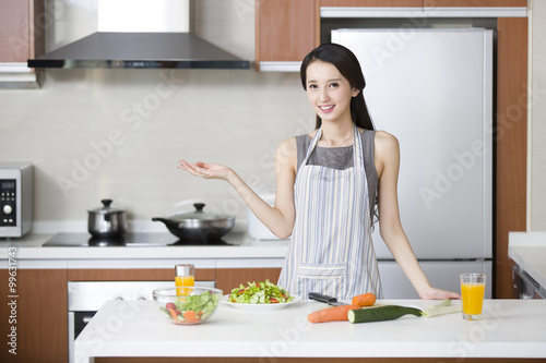 Young woman cooking in the kitchen