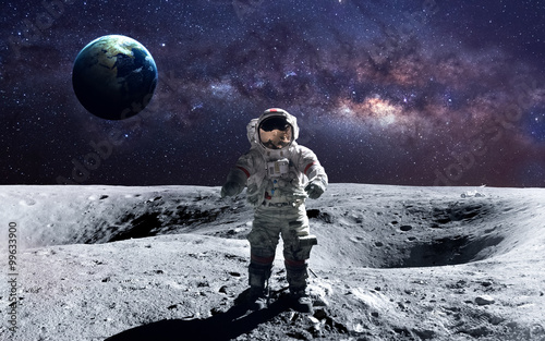 Fototapeta Naklejka Na Ścianę i Meble -  Brave astronaut at the spacewalk on the moon. This image elements furnished by NASA.