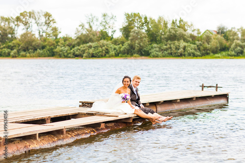 wedding couple near water