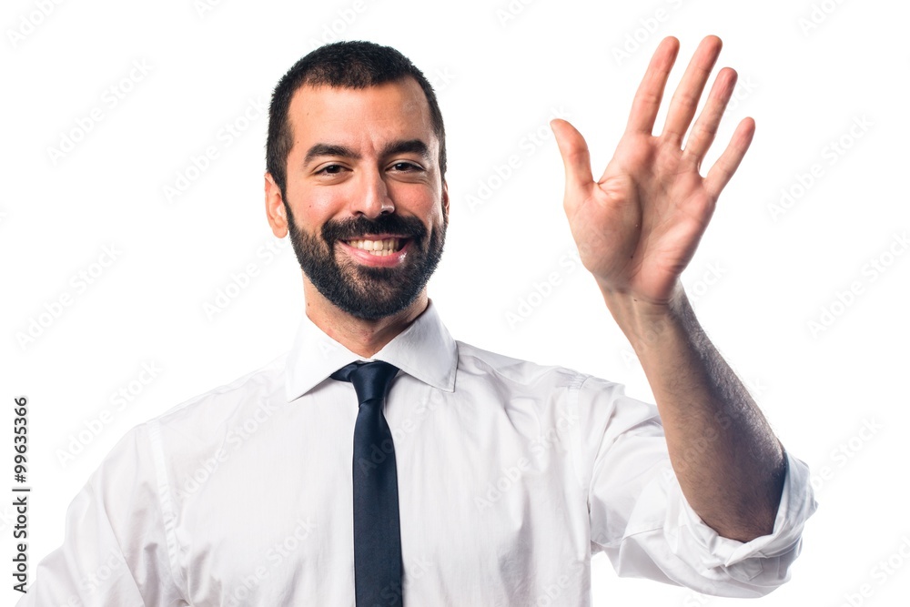 Businessman saluting