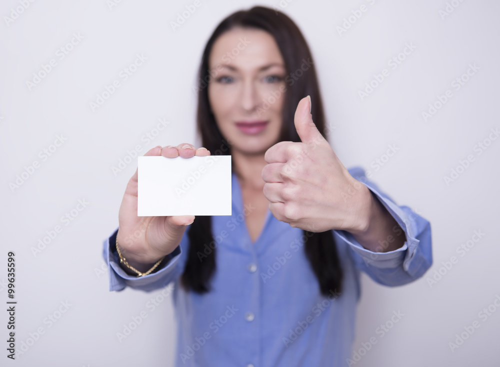 beautiful brunette business woman in working attire posing on grey background beautiful brunette business woman in working attire posing on grey background