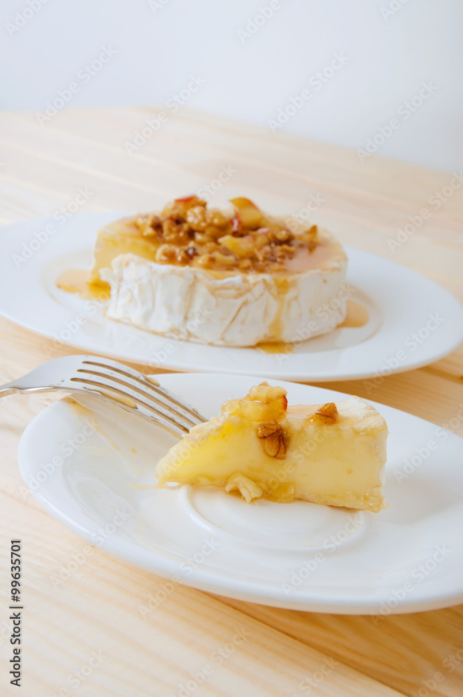 Camembert cheese with honey sauce with nuts and butter Camembert cheese with honey sauce with nuts and butter