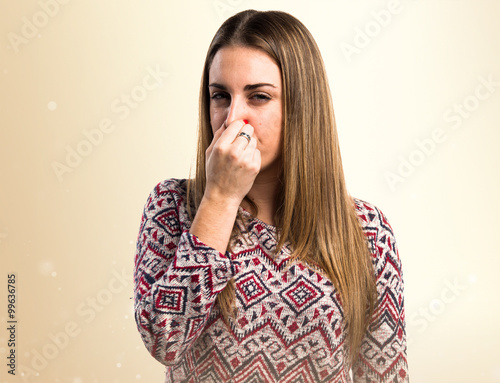 Картината върху платно Blonde woman making smelling bad gesture