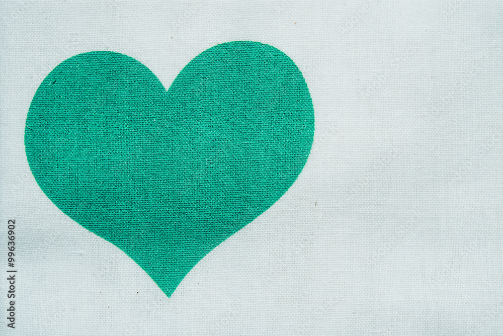 Green heart with key on wooden background. Green heart with key on wooden background.
