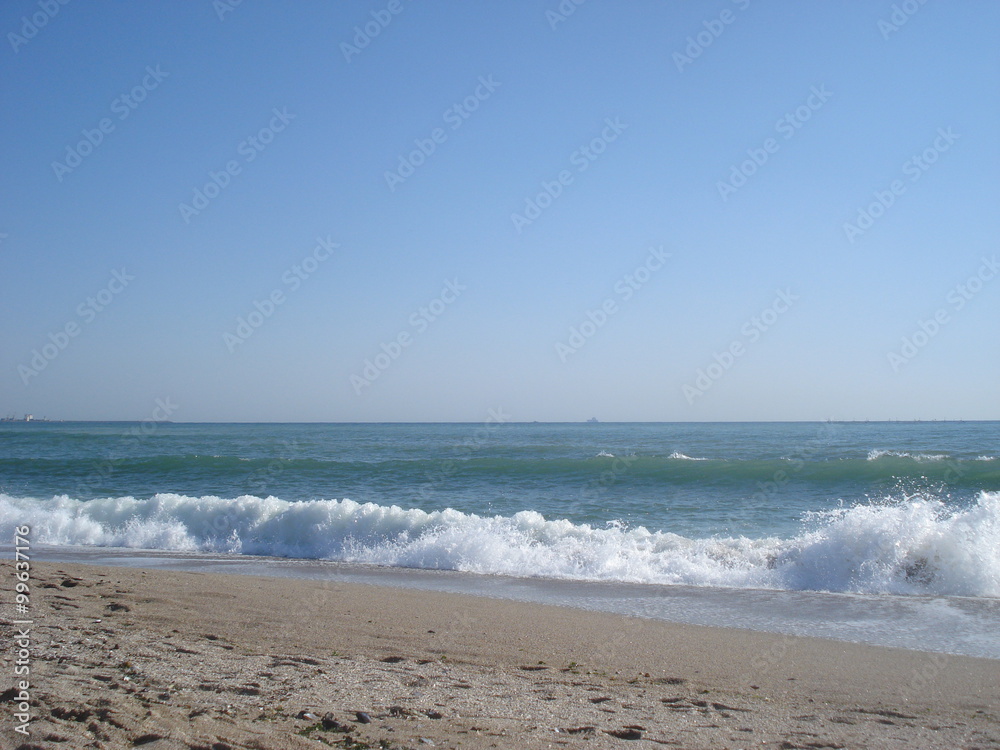 Foamy broken wave at sea shore