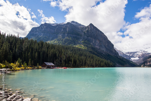 kayaks rental at the turquoise water's edge of lake louise in the rocky mountains of alberta canada