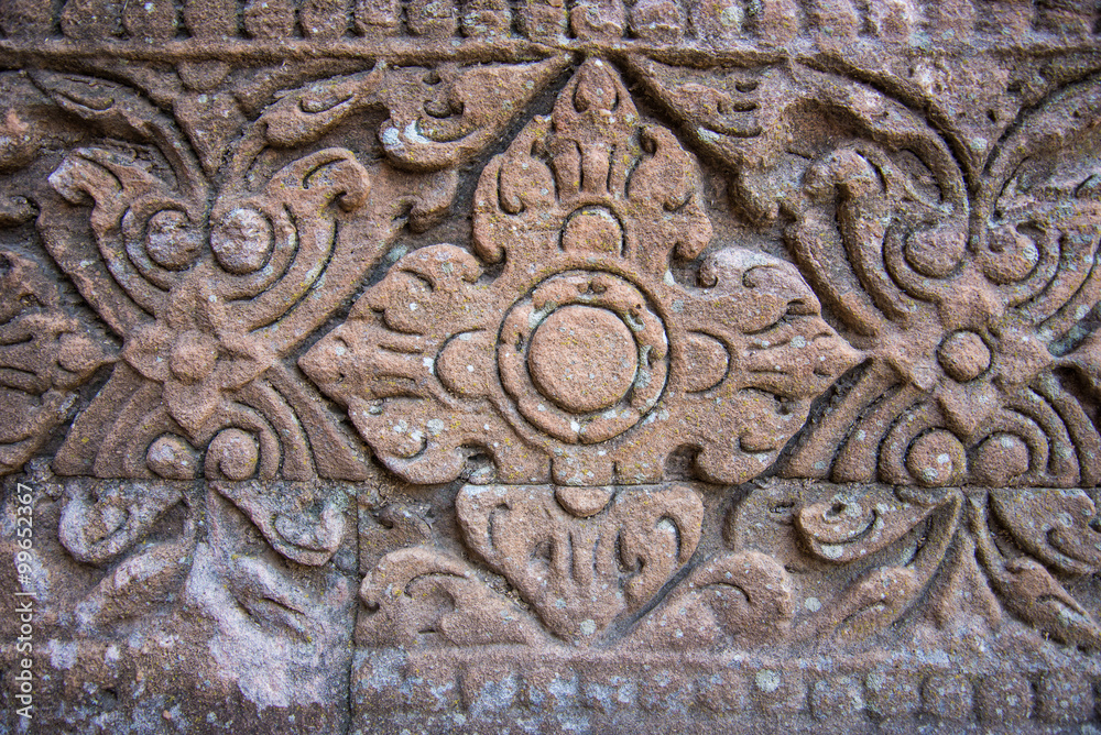 Vintage style carving art on stone brick wall