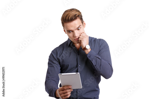 frustrated young man with tablet