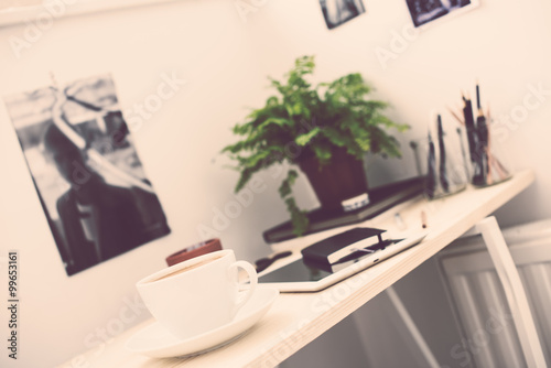 Cup of coffe in modern loft-style office