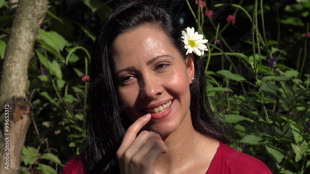Smiling Hispanic Woman at Flower Garden Smiling Hispanic Woman at Flower Garden