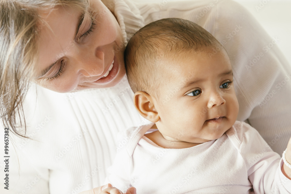 Portrait of a mother with her baby at home. Portrait of a mother with her baby at home.