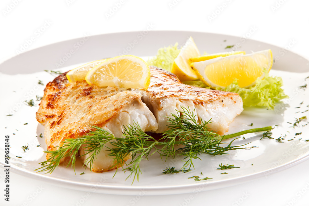 Fish dish - fried fish fillet and vegetables Fish dish - fried fish fillet and vegetables