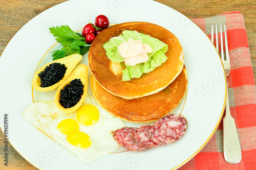Pancakes with Quail Eggs, Cold Meats, Pastry Spoon with Black Ca