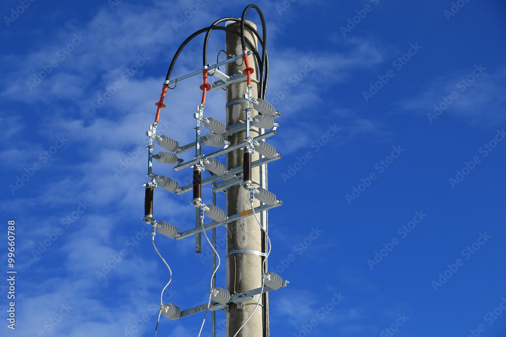 Power isolator switch manual on electrical pylon against the blue sky Power isolator switch manual on electrical pylon against the blue sky