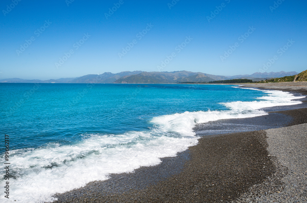 Kaioura beach with waves, blue sea and blue sky