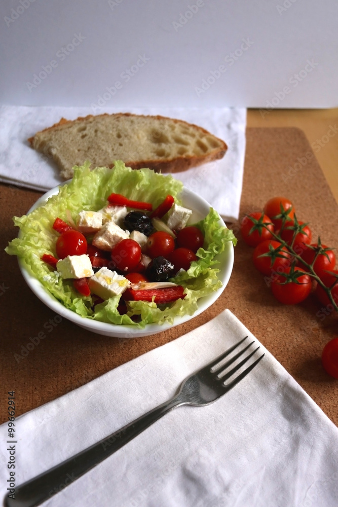 Greek salad with cherry tomatoes, red peppers, black olives,onion and feta cheese. Selective focus. Greek salad with cherry tomatoes, red peppers, black olives,onion and feta cheese. Selective focus.