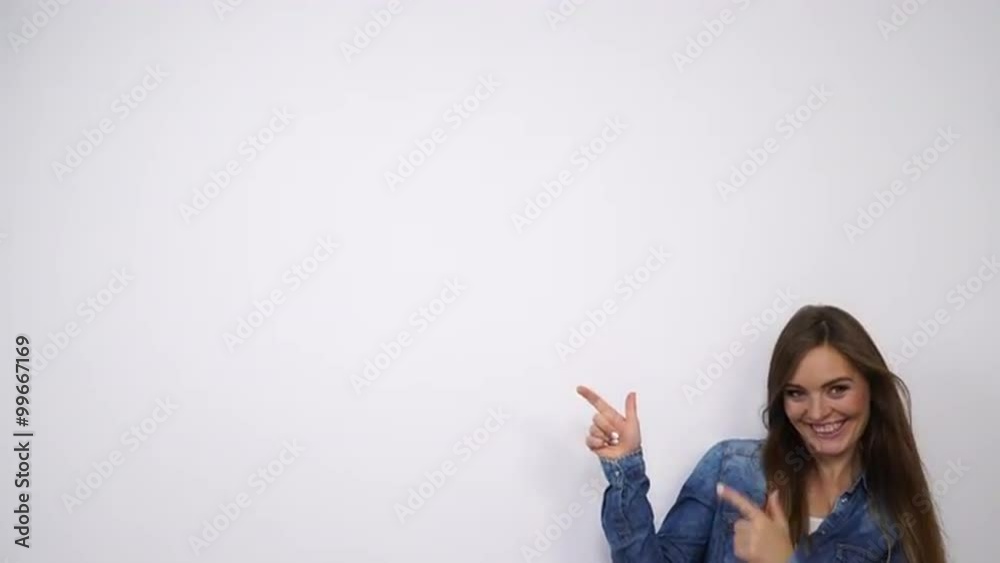 Woman pointing empty copyspace giving thumb up 4K. Woman pointing empty copyspace giving thumb up 4K.