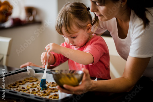 Obraz na plátně Mother and child baking together