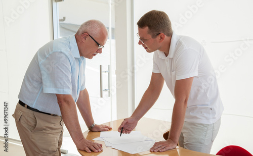 Two businessmen discussing a joint project