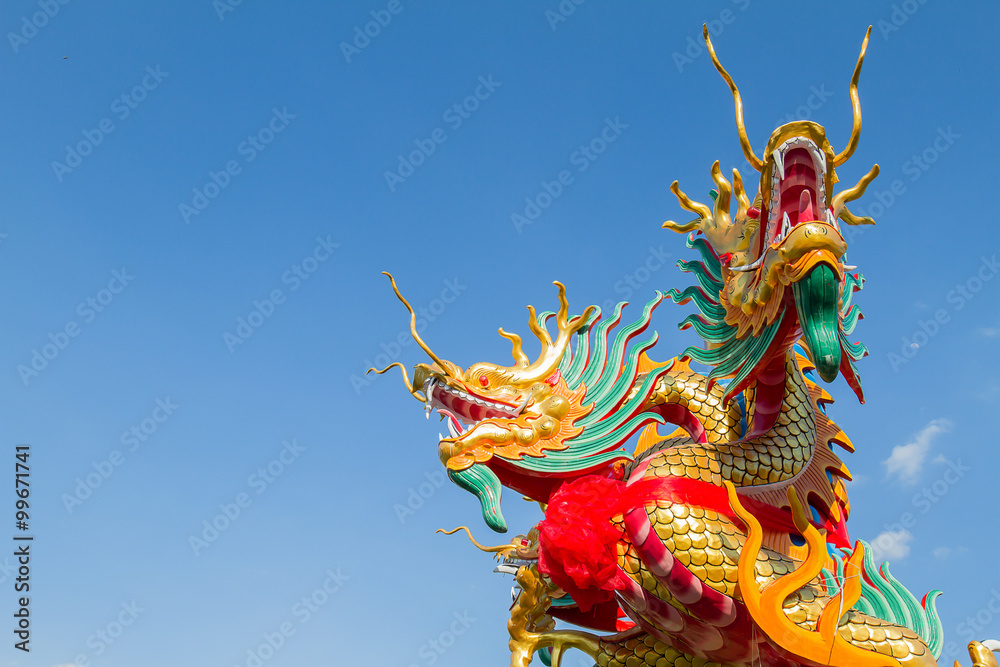 Dragon head on blue sky background