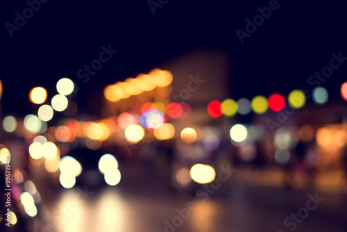 Blurred background of colorful light at Party night, vintage effect style © jakkapan