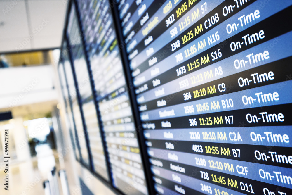 Fototapeta premium info of flight on billboard in airport
