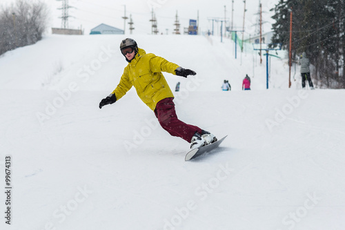 snowboarder slides from the mountain