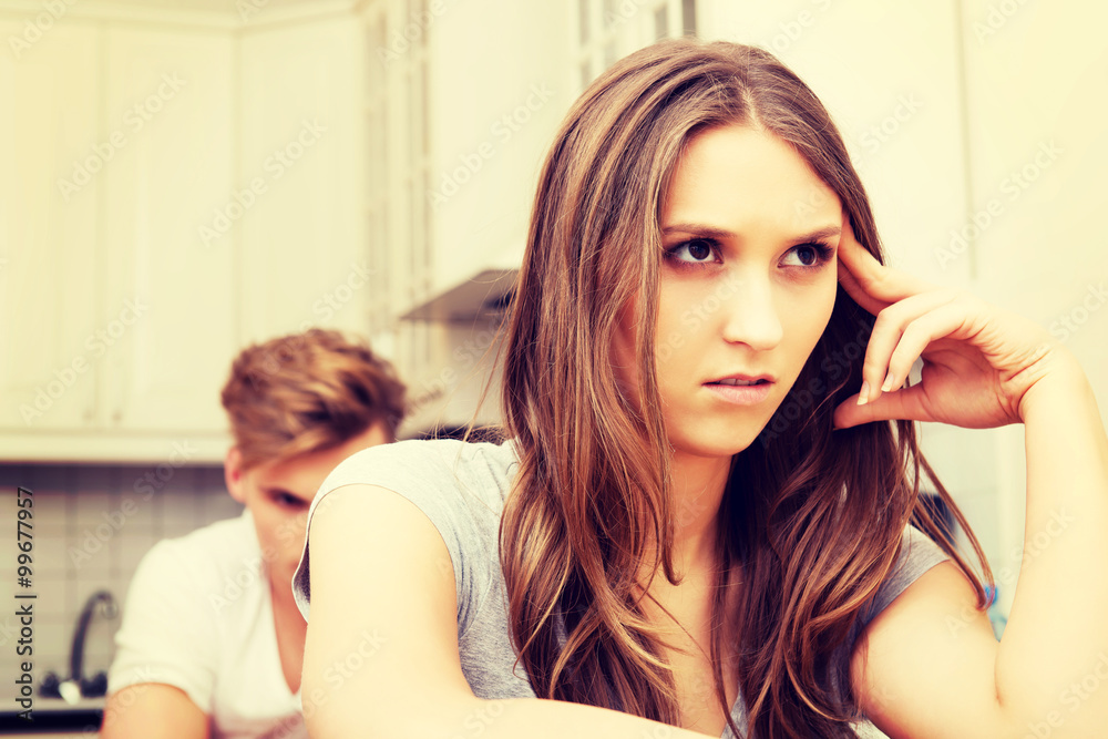 Fototapeta premium Couple having an argument in the kitchen.