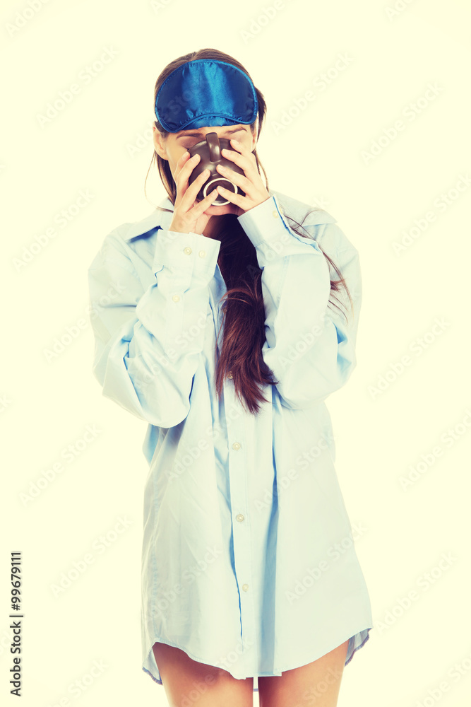 Morning woman in big shirt drinking coffee. Morning woman in big shirt drinking coffee.