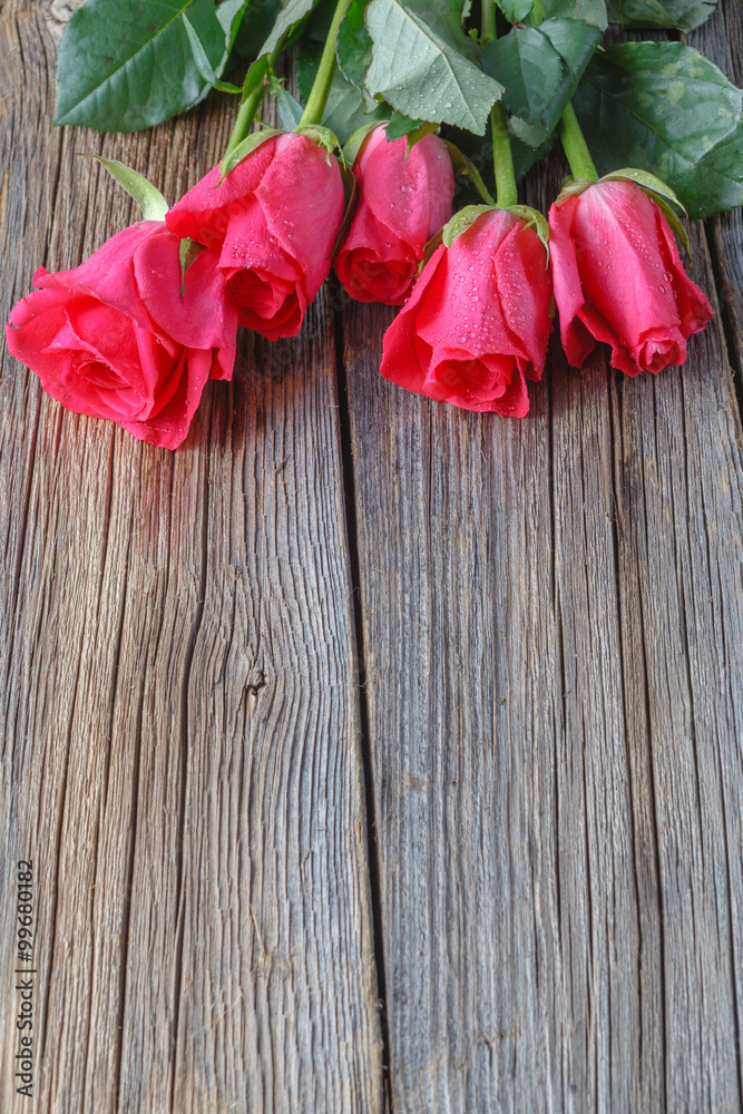 Roses bouquet on rustic wooden table