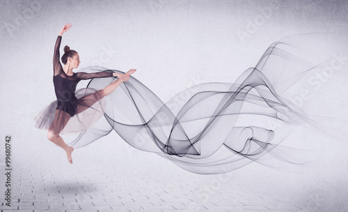 Modern ballet dancer performing with abstract swirl