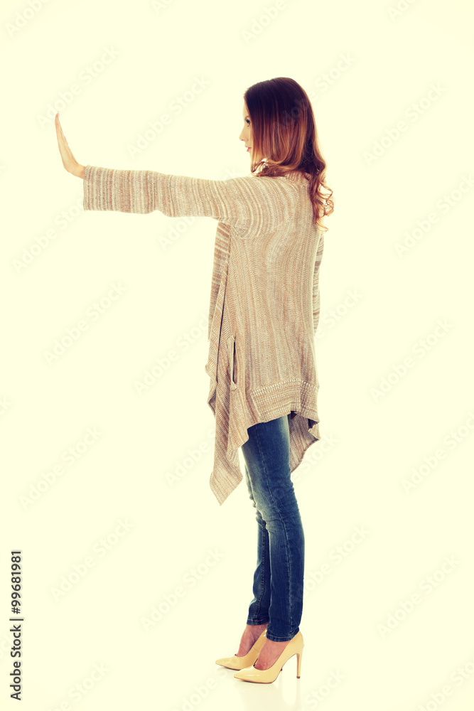 Casual woman making stop gesture. Casual woman making stop gesture.