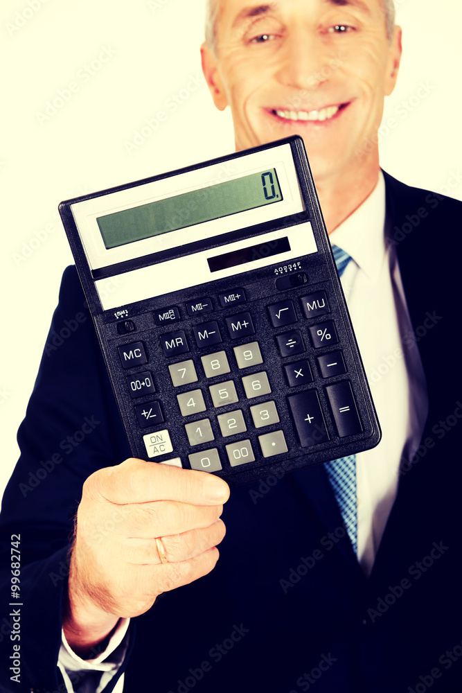 Happy businessman holding a calculator Happy businessman holding a calculator