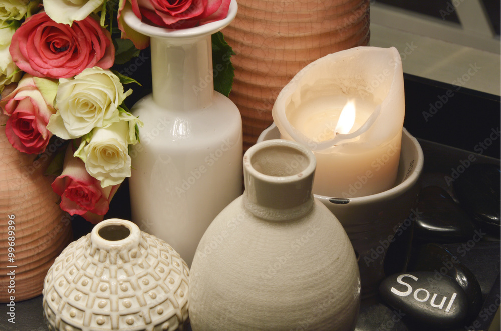 stone massage with pink rose petals and caldle light  (soft focus,lens blur)