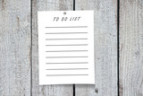 Paper note, wooden background