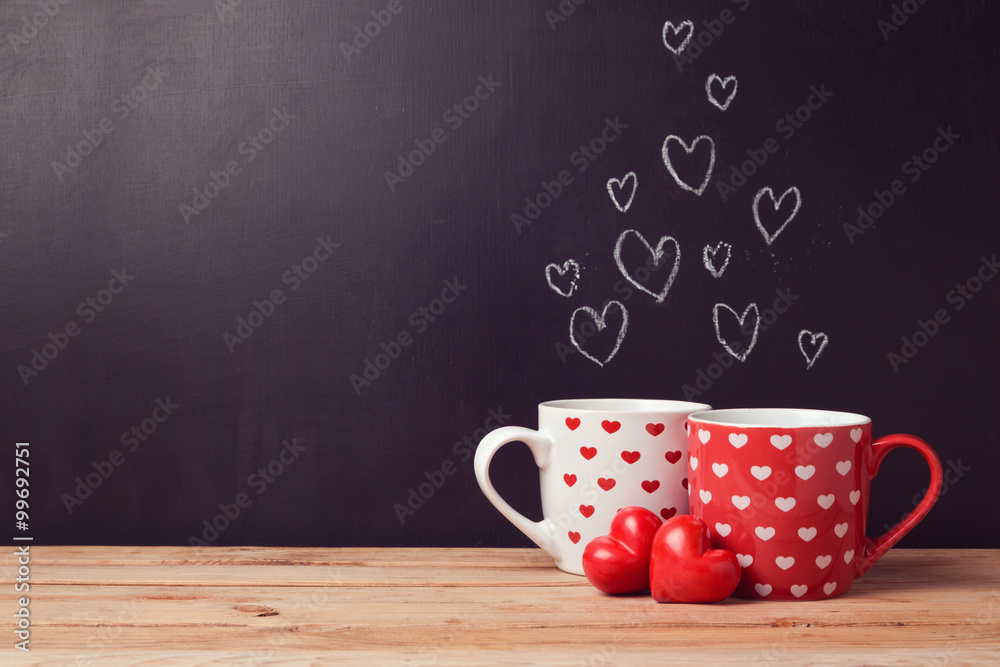 Valentine's day concept with hearts and cups over chalkboard background - obrazy, fototapety, plakaty 