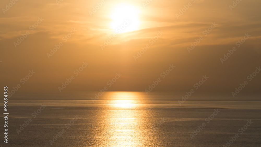 Perspectives of beautiful sunset above the sea. Orange sky.