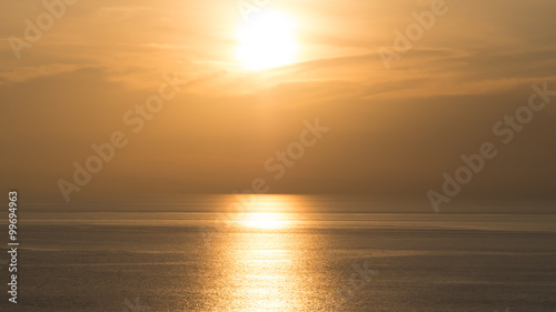 Perspectives of beautiful sunset above the sea. Orange sky.