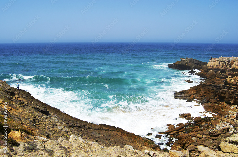 Waves breaking against coast near Sintra, Portugal