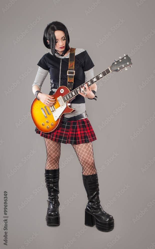 Guitar girl / Gothic young woman with her hot guitar Guitar girl / Gothic young woman with her hot guitar