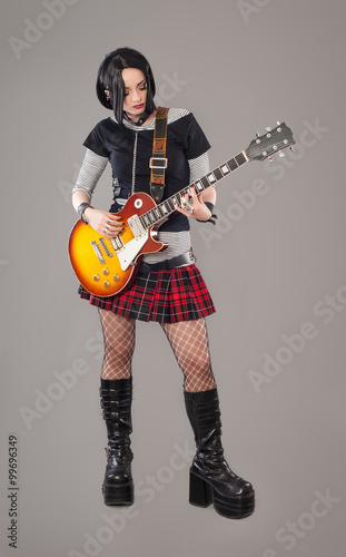Guitar girl / Gothic young woman with her hot guitar