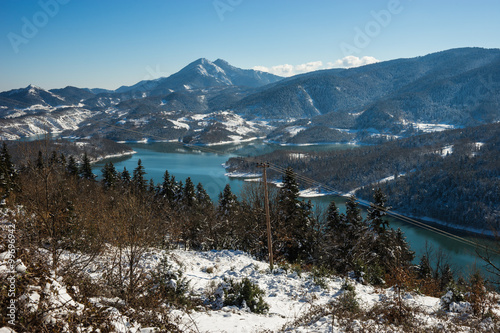 Winter snowy landscape with lake Plastira, Fesalia, Greece photo