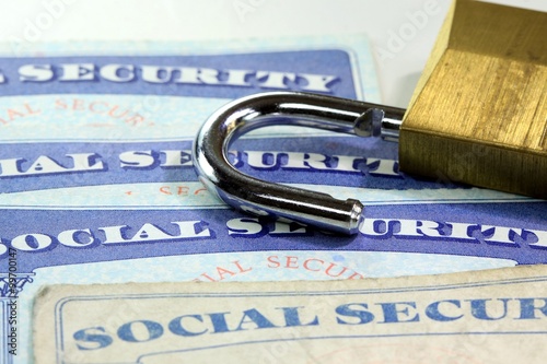 Padlock and social security card - Identity theft and identity protection concept
