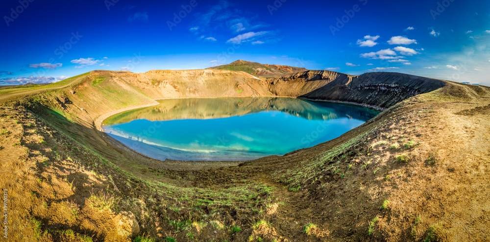 Panorama of blue lake in the crater of a volcano in Iceland