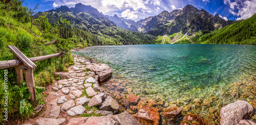Panorama of pond in the middle of the Tatra mountains photo