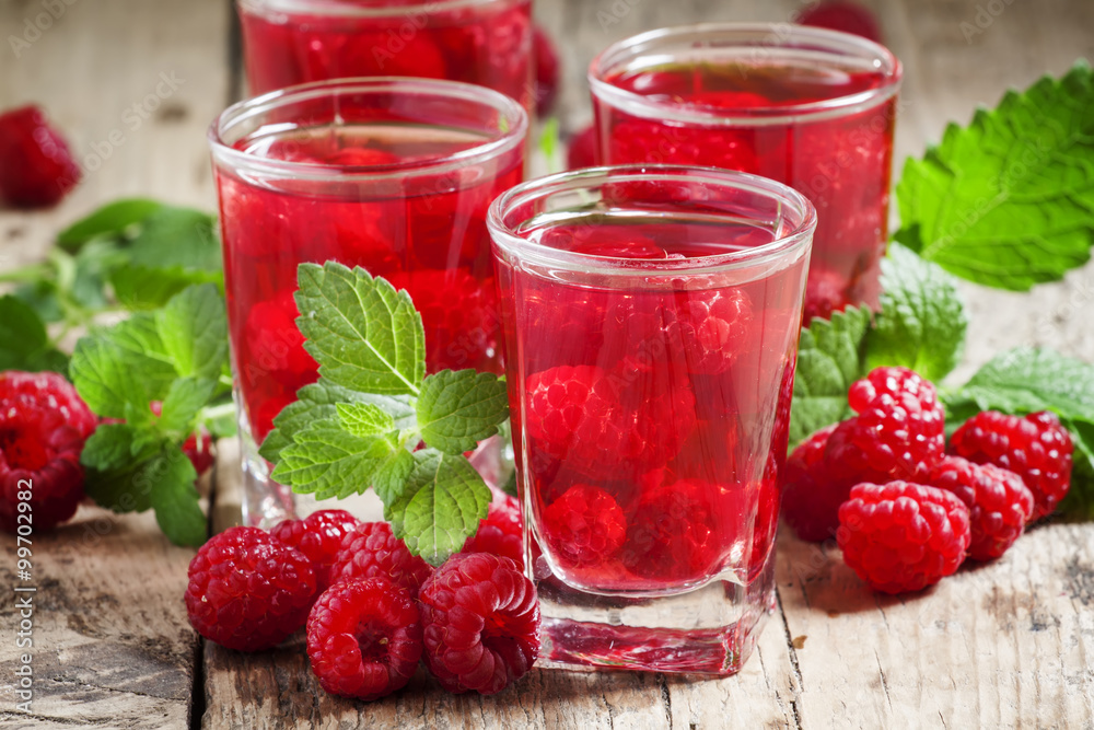 Refreshing raspberry drink with berries and mint, selective focu Refreshing raspberry drink with berries and mint, selective focu